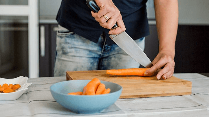 Hands preparing vegetables mindfully